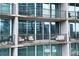 Relax on your private balcony with comfortable seating, potted plants, and cityscape views at 1080 Peachtree Ne St # 2108, Atlanta, GA 30309