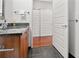 Bathroom featuring a modern sink vanity with lots of storage and dark tile floors at 1080 Peachtree Ne St # 2108, Atlanta, GA 30309