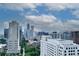 Elevated city view featuring modern architecture, mature trees, and vibrant cityscape skyline at 1080 Peachtree Ne St # 2108, Atlanta, GA 30309