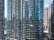 Exterior view of modern high-rise condominium building with curved glass balconies at 1080 Peachtree Ne St # 2108, Atlanta, GA 30309