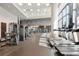 Well-equipped fitness center with treadmills, weight machines, and floor to ceiling window views at 1080 Peachtree Ne St # 2108, Atlanta, GA 30309