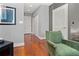 Hallway with hardwood floors and an accent chair for decor at 1080 Peachtree Ne St # 2108, Atlanta, GA 30309