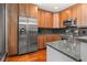 A modern kitchen with stainless steel appliances, sleek countertops, and hardwood floors at 1080 Peachtree Ne St # 2108, Atlanta, GA 30309