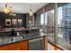 Modern kitchen with stainless steel appliances, granite countertops, and balcony access at 1080 Peachtree Ne St # 2108, Atlanta, GA 30309