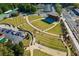 Aerial shot of a large outdoor amphitheater with grass seating and parking area at 1202 Charleston Ct Cir, Woodstock, GA 30188
