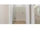 Walk-in closet with laminate floors and installed shelving, located adjacent to bedroom at 1202 Charleston Ct Cir, Woodstock, GA 30188