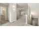 Spacious living room featuring neutral paint and plush carpeting, flowing into the entryway and staircase at 1202 Charleston Ct Cir, Woodstock, GA 30188