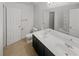 Bathroom with double vanity sinks, a toilet, and a mirror at 3972 Carlinswood Way, Stone Mountain, GA 30083