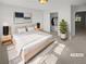 Serene bedroom with a plush bed, minimalist decor, and ample closet space at 3972 Carlinswood Way, Stone Mountain, GA 30083