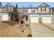 Charming townhouse showcasing a well-manicured lawn, a single-car garage, and neutral-colored siding at 3972 Carlinswood Way, Stone Mountain, GA 30083