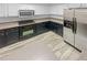 Well-lit kitchen featuring stainless steel appliances, and stylish two-tone cabinetry at 3972 Carlinswood Way, Stone Mountain, GA 30083