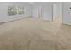 Spacious main bedroom with plush carpeting and a large window at 3972 Carlinswood Way, Stone Mountain, GA 30083