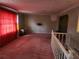 Second floor living room with pink carpet and natural light at 6696 Brookwood Cir, Jonesboro, GA 30236