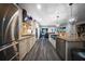 Modern kitchen featuring stainless steel appliances and a view into the dining room at 149 Avalon Way, Sharpsburg, GA 30277