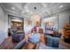 Living room with views to foyer and dining, featuring coffered ceilings and hardwood floors at 149 Avalon Way, Sharpsburg, GA 30277