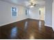 Bright main bedroom featuring hardwood floors, a ceiling fan, and an ensuite at 1641 Pendley Dr, Austell, GA 30168