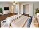 Staged main bedroom featuring hardwood floors, ceiling fan, and ensuite bathroom at 1641 Pendley Dr, Austell, GA 30168