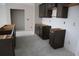 Spacious new kitchen with dark cabinets awaiting countertops, set for personalization at 1975 William Glen St, Dacula, GA 30019