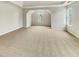 Spacious bedroom with unique window shapes, neutral carpet, and natural light at 3414 Bench Ave, Atlanta, GA 30349