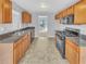 Well-equipped kitchen with wood cabinets and modern appliances at 3414 Bench Ave, Atlanta, GA 30349