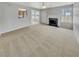 Spacious living room featuring neutral paint and carpet, with a fireplace at 3414 Bench Ave, Atlanta, GA 30349