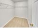 Walk-in closet featuring built-in shelving and carpet flooring at 3414 Bench Ave, Atlanta, GA 30349