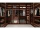 Spacious walk-in closet with custom wood cabinetry offering plenty of storage and organization options at 2709 Dennard, Conyers, GA 30013