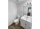 Bathroom with white vanity, sink, toilet, tile floor and new fixtures at 61 Barrington Pl, Marietta, GA 30066