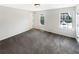 Spacious bedroom featuring plush carpeting, neutral walls, and natural light from two windows at 61 Barrington Pl, Marietta, GA 30066