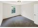 Bright bedroom with a window providing natural light, plus soft carpeting at 61 Barrington Pl, Marietta, GA 30066