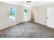 Bright bedroom with neutral walls, plush carpet, and natural light from the window at 61 Barrington Pl, Marietta, GA 30066