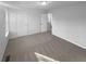 Bedroom with neutral walls, carpet, and natural light from windows at 61 Barrington Pl, Marietta, GA 30066