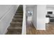 Entryway with carpeted stairs leading to the kitchen and living room at 61 Barrington Pl, Marietta, GA 30066