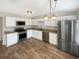 Modern kitchen features stainless steel appliances and bright lighting at 61 Barrington Pl, Marietta, GA 30066