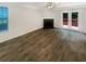 Open living room boasting a fireplace, patio access, and stylish flooring at 61 Barrington Pl, Marietta, GA 30066