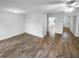 Spacious living room with hardwood floors and neutral paint, leading to the front door and other rooms at 61 Barrington Pl, Marietta, GA 30066