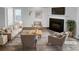 Bright, staged living room features neutral furniture, fireplace, and stylish decor at 61 Barrington Pl, Marietta, GA 30066