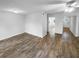 Bright living room features neutral walls, ceiling fan, and wood-look flooring at 61 Barrington Pl, Marietta, GA 30066