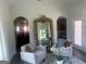 Sitting area with chairs, large mirror and views of living and dining rooms at 835 Crossroads Ct, Social Circle, GA 30025