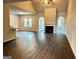 Hardwood floors compliment the living room with an archway to a gas fireplace at 835 Crossroads Ct, Social Circle, GA 30025