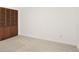 This bedroom is a blank slate with carpet and a large closet at 1526 Fernbrook Sw Ct, Lilburn, GA 30047