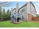 Back exterior with deck, stone accents, green lawn, and walkout basement space for outdoor living at 3130 Kates Nw Way, Kennesaw, GA 30152