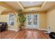 Finished basement area featuring a walkout to the backyard, hardwood floors, and bright light at 3130 Kates Nw Way, Kennesaw, GA 30152