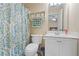 Bathroom featuring toilet, vanity, and patterned shower curtain at 3130 Kates Nw Way, Kennesaw, GA 30152