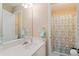 Bathroom featuring single sink vanity, mirror and shower with patterned curtain at 3130 Kates Nw Way, Kennesaw, GA 30152