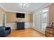 Cozy living room with hardwood floors, plantation shutters, custom bar and barrel accents at 3130 Kates Nw Way, Kennesaw, GA 30152