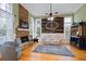Comfortable living room with a stone fireplace, built-in bar, and hardwood floors at 3130 Kates Nw Way, Kennesaw, GA 30152