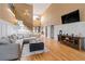 Bright living room with high ceilings, hardwood floors, and a staircase with decorative iron railings at 3130 Kates Nw Way, Kennesaw, GA 30152