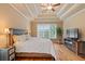 Comfortable main bedroom featuring hardwood floors, tray ceilings, and ample natural light at 3130 Kates Nw Way, Kennesaw, GA 30152