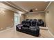Home theater with tiered seating, projector, sconce lighting and space to enjoy movies with the Gathering at 3130 Kates Nw Way, Kennesaw, GA 30152